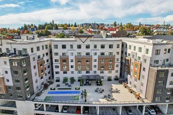 A view of a courtyard surrounded by apartment buildings.